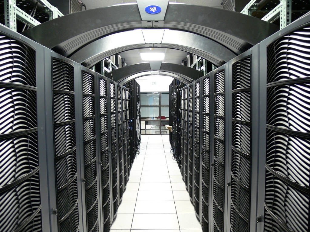 Rows of server racks in a data center — managed inference you don't have to operate