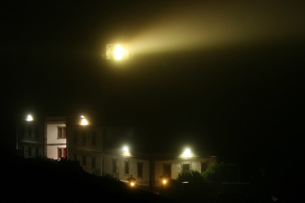 A lighthouse throwing a beam of light through thick fog — cutting visibility through the noise.